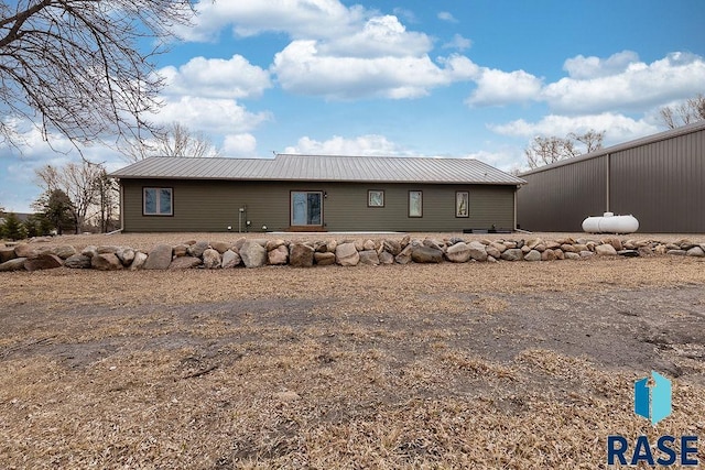 exterior space featuring metal roof