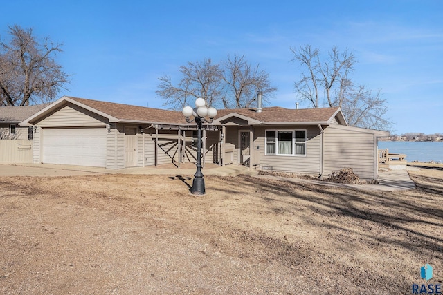 ranch-style house featuring driveway and a garage