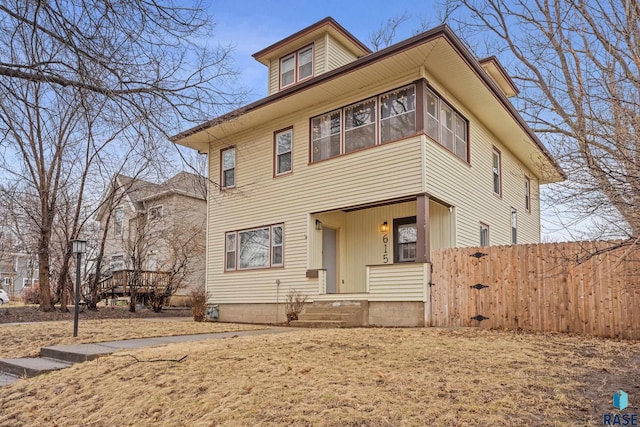 view of front of house featuring fence