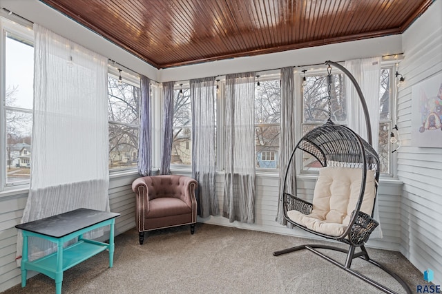 sunroom / solarium with wood ceiling and carpet flooring