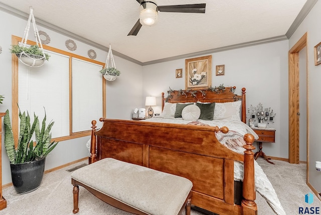 carpeted bedroom featuring a textured ceiling, ornamental molding, visible vents, and ceiling fan