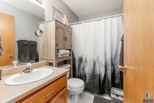 bathroom with a textured ceiling, a shower with shower curtain, toilet, vanity, and tile patterned flooring