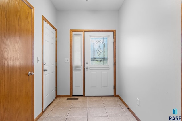 4612 E Pampas Pl, Sioux Falls, SD 57110 - foyer entrance with light tile patterned floors and baseboards