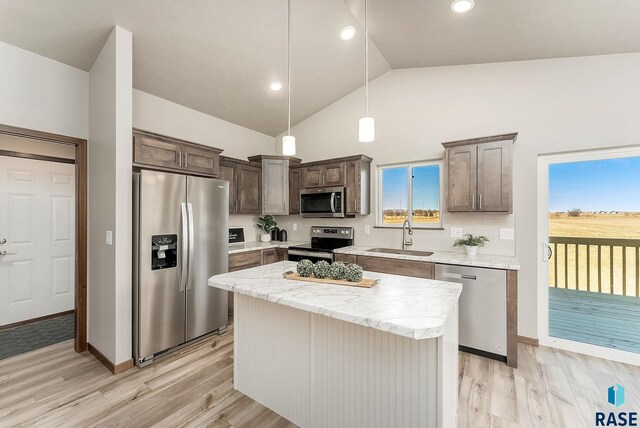1320 Poplar Ave, Tea, SD 57064 - kitchen with light wood-type flooring, a sink, dark brown cabinets, and appliances with stainless steel finishes