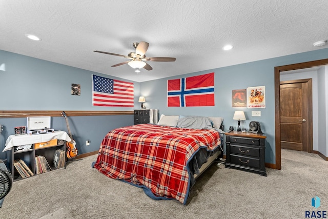 bedroom featuring ceiling fan, carpet flooring, and baseboards