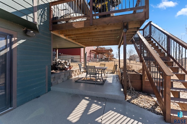 view of patio / terrace with stairway and outdoor dining area