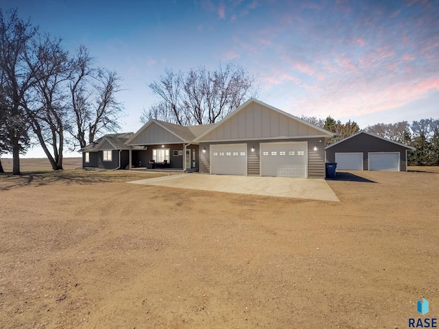 47748 255th St, Garretson, SD 57030 - view of front of house with board and batten siding, driveway, and a garage