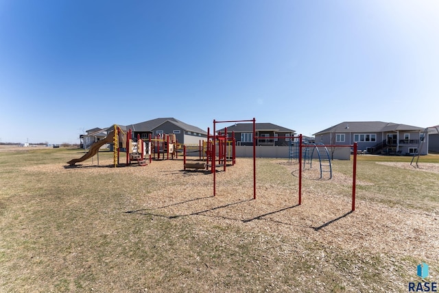 community jungle gym with a yard and a residential view