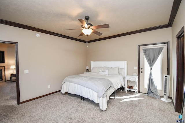 bedroom with a ceiling fan, carpet flooring, baseboards, and ornamental molding
