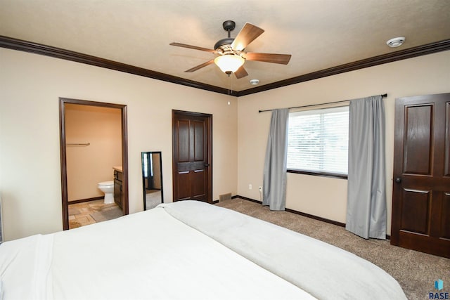 bedroom featuring light carpet, baseboards, crown molding, and connected bathroom