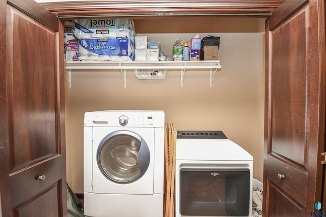 laundry room featuring washer and clothes dryer and laundry area