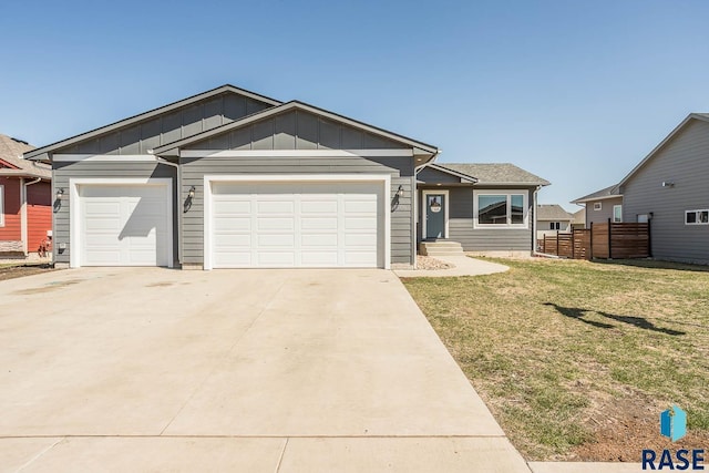 single story home featuring board and batten siding, fence, a front lawn, an attached garage, and concrete driveway