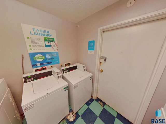 901-909 N Cleveland Ave, Sioux Falls, SD 57103 - community laundry room with tile patterned floors, independent washer and dryer, and a textured ceiling