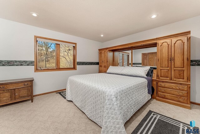 7 N Sun Valley Pl, Sioux Falls, SD 57110 - bedroom featuring baseboards, recessed lighting, and light colored carpet