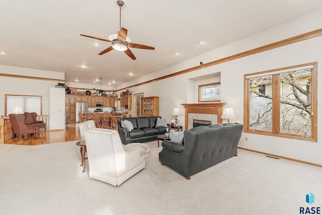7 N Sun Valley Pl, Sioux Falls, SD 57110 - living area with baseboards, recessed lighting, a tiled fireplace, a ceiling fan, and visible vents