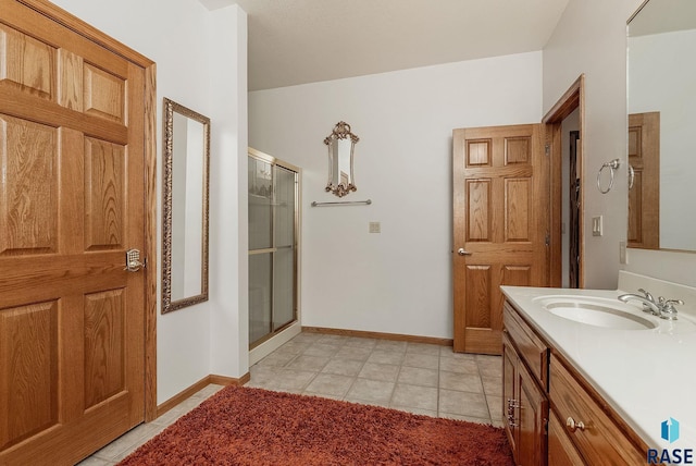 7 N Sun Valley Pl, Sioux Falls, SD 57110 - bathroom with a shower stall, vanity, baseboards, and tile patterned flooring