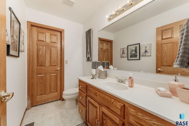 7 N Sun Valley Pl, Sioux Falls, SD 57110 - bathroom with visible vents, toilet, and vanity