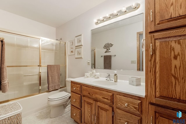 7 N Sun Valley Pl, Sioux Falls, SD 57110 - full bathroom featuring bath / shower combo with glass door, vanity, toilet, and tile patterned flooring