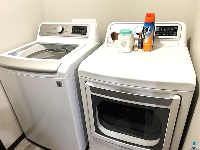 laundry area featuring washing machine and clothes dryer