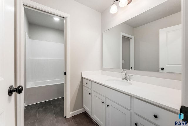 full bathroom with tile patterned flooring, vanity, and baseboards