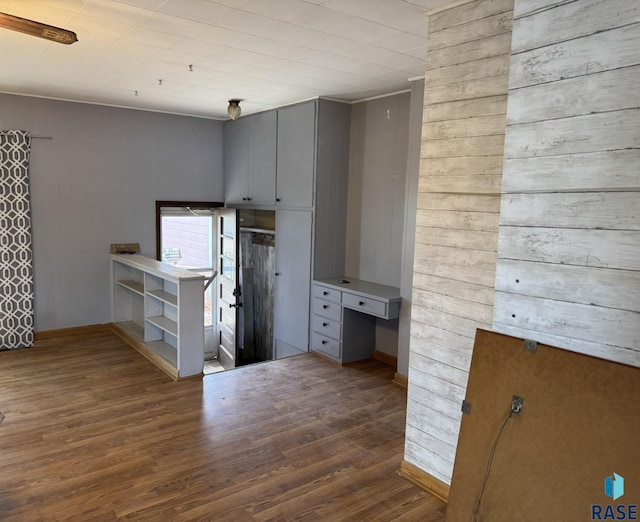 1413 E Rice St, Sioux Falls, SD 57103 - kitchen with wooden walls, gray cabinets, and wood finished floors