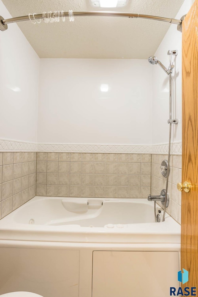 bathroom with a textured ceiling