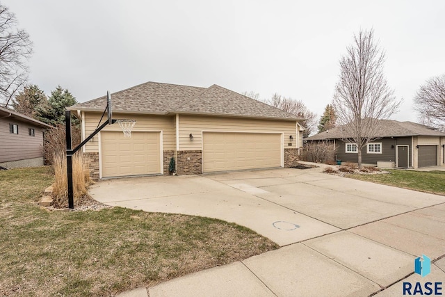 view of property exterior with concrete driveway, roof with shingles, an outdoor structure, brick siding, and a garage