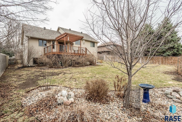 view of front of property featuring a fenced backyard, a front yard, a wooden deck, and stairs