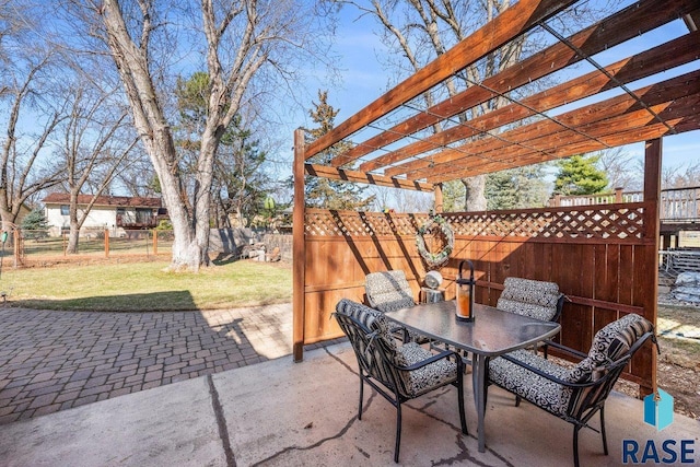 view of patio / terrace with a pergola, outdoor dining area, and fence
