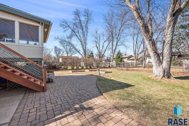 view of yard featuring a patio and fence