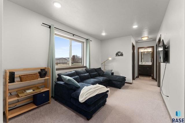 living room with light carpet, baseboards, and recessed lighting
