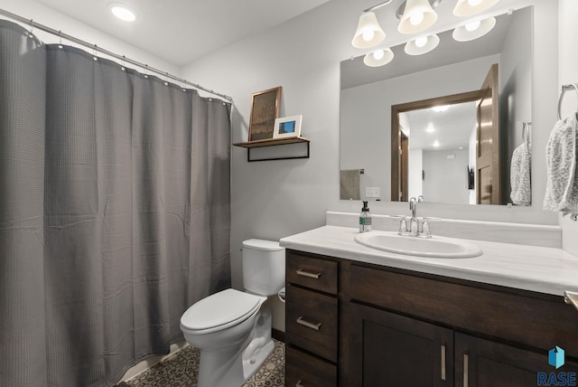 bathroom with vanity, a shower with curtain, and toilet