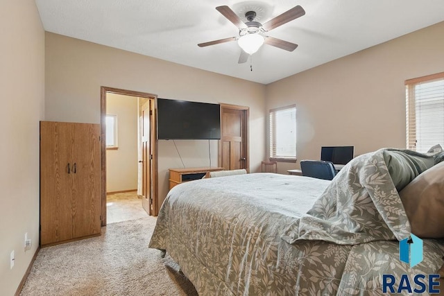 7705 W Vista Park St, Sioux Falls, SD 57106 - bedroom featuring a ceiling fan, light carpet, baseboards, and multiple windows
