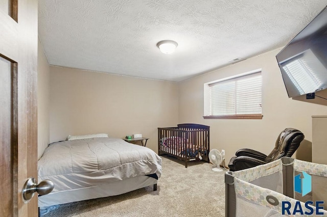 7705 W Vista Park St, Sioux Falls, SD 57106 - carpeted bedroom with visible vents and a textured ceiling