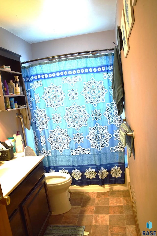 full bathroom with vanity and toilet
