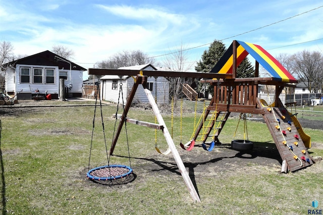 view of jungle gym featuring fence and a lawn