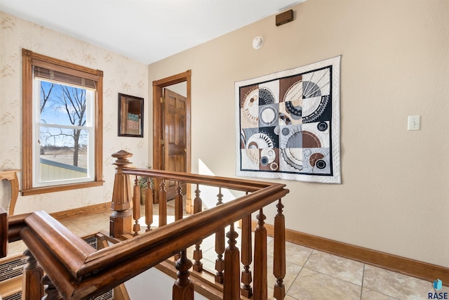 staircase with tile patterned floors and baseboards