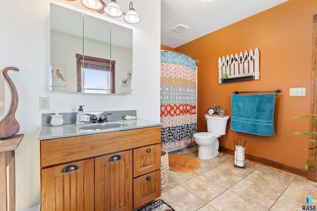 bathroom featuring vanity, baseboards, tile patterned flooring, toilet, and visible vents