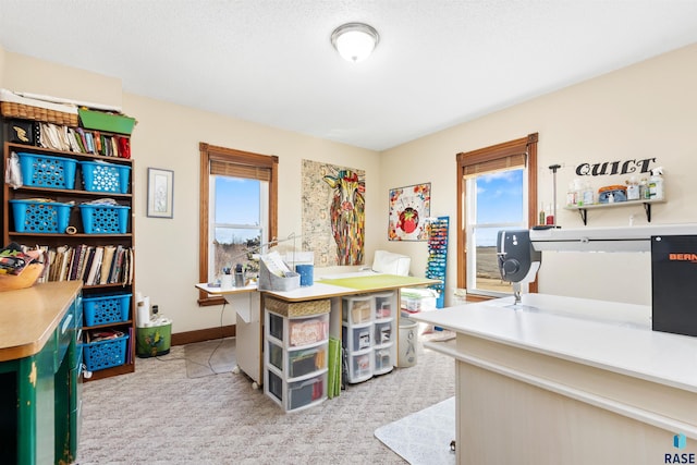 office featuring light carpet and baseboards