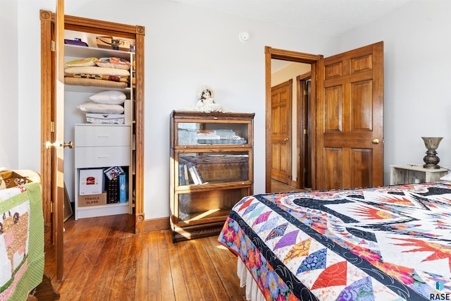 bedroom featuring wood-type flooring