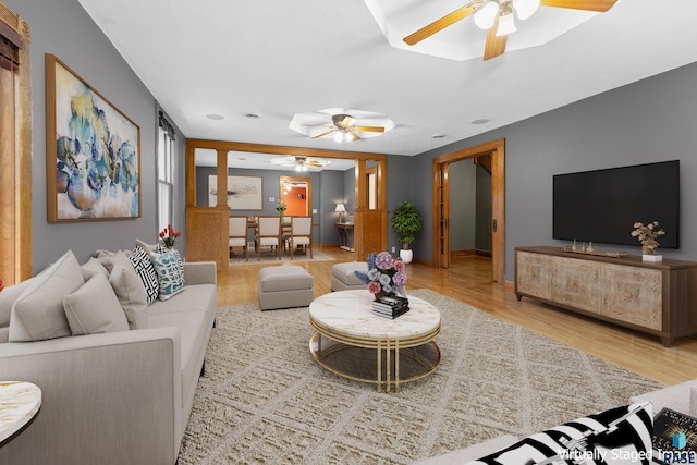 209 S 3rd St, Beresford, SD 57004 - living room with baseboards, a ceiling fan, and wood finished floors