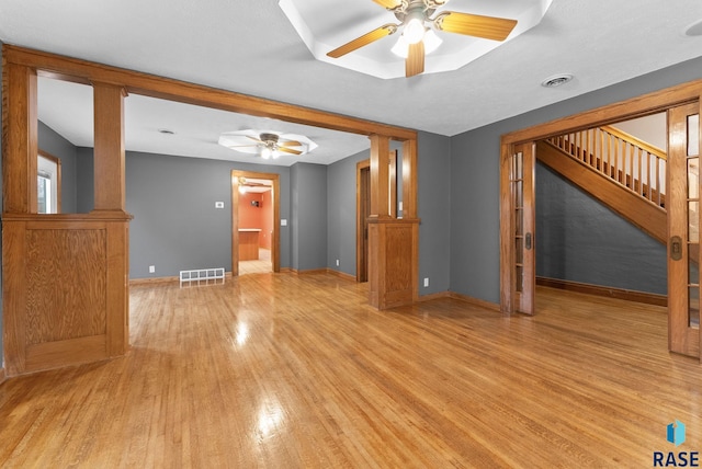 209 S 3rd St, Beresford, SD 57004 - unfurnished living room featuring visible vents, ceiling fan, and light wood-style floors