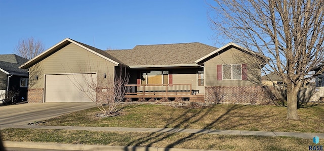 single story home with brick siding, driveway, an attached garage, and a front lawn