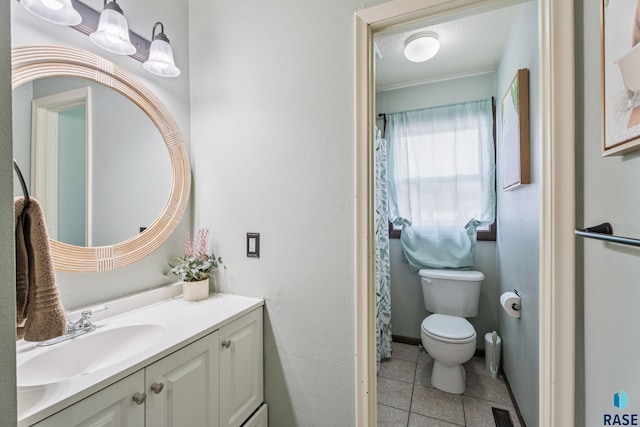 full bathroom with a textured ceiling, vanity, tile patterned flooring, visible vents, and toilet