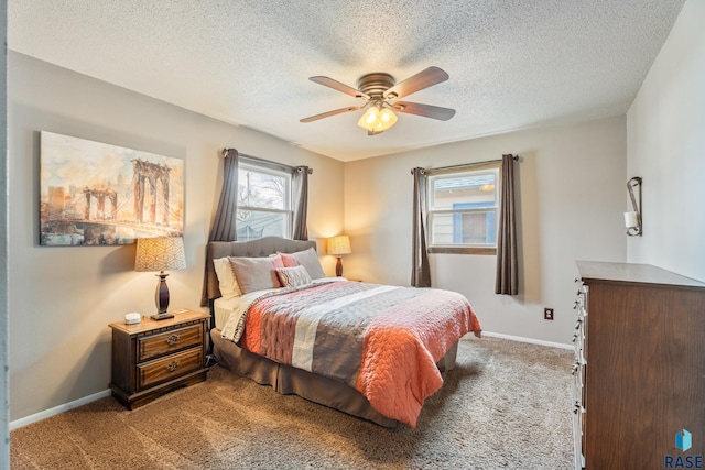 bedroom with carpet flooring, baseboards, a ceiling fan, and a textured ceiling