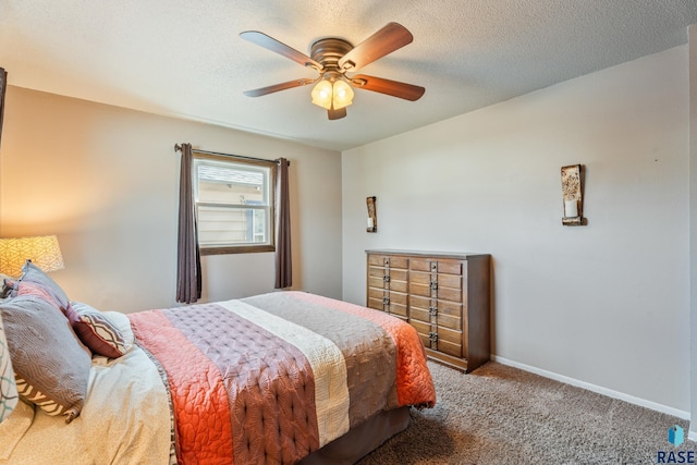 bedroom featuring carpet flooring, baseboards, a textured ceiling, and ceiling fan