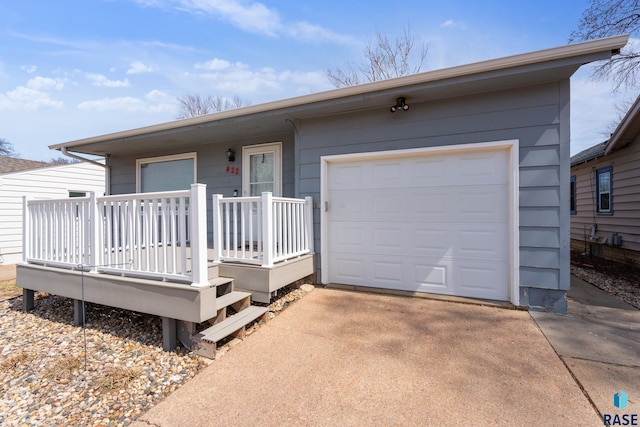ranch-style home with concrete driveway