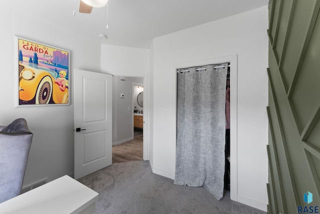 carpeted bedroom with ceiling fan