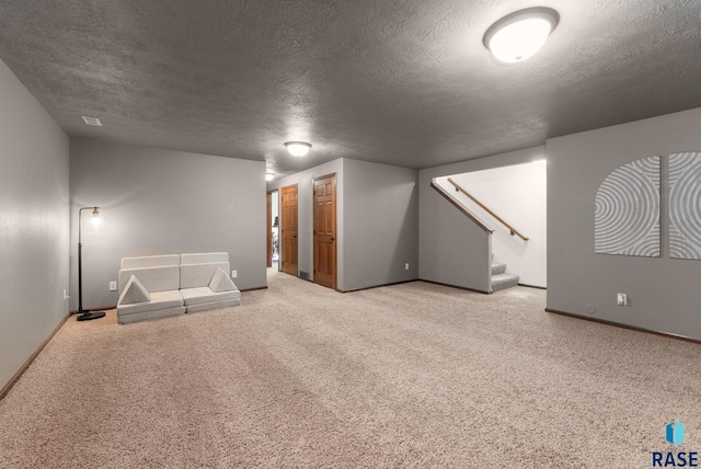 bonus room with carpet floors, baseboards, stairway, and a textured ceiling