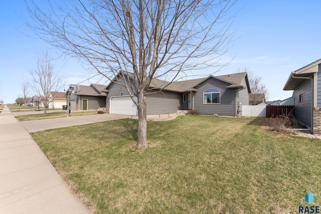 ranch-style home featuring a front yard, driveway, fence, and an attached garage